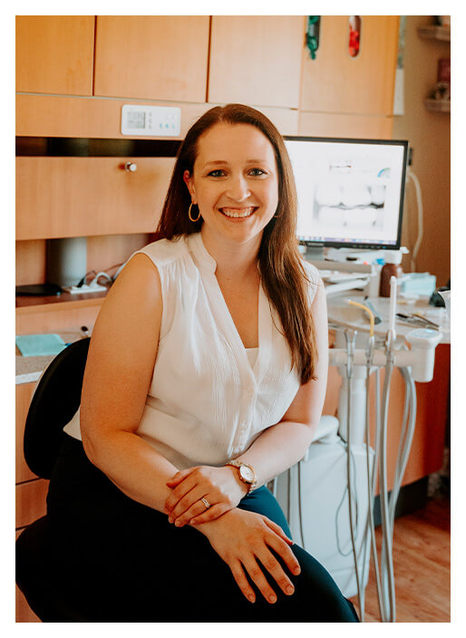 Dr. Behring smiling in chair